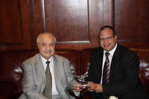 Mr. Talal Abu-Ghazaleh receives an Honorary Shield from Mr. ...