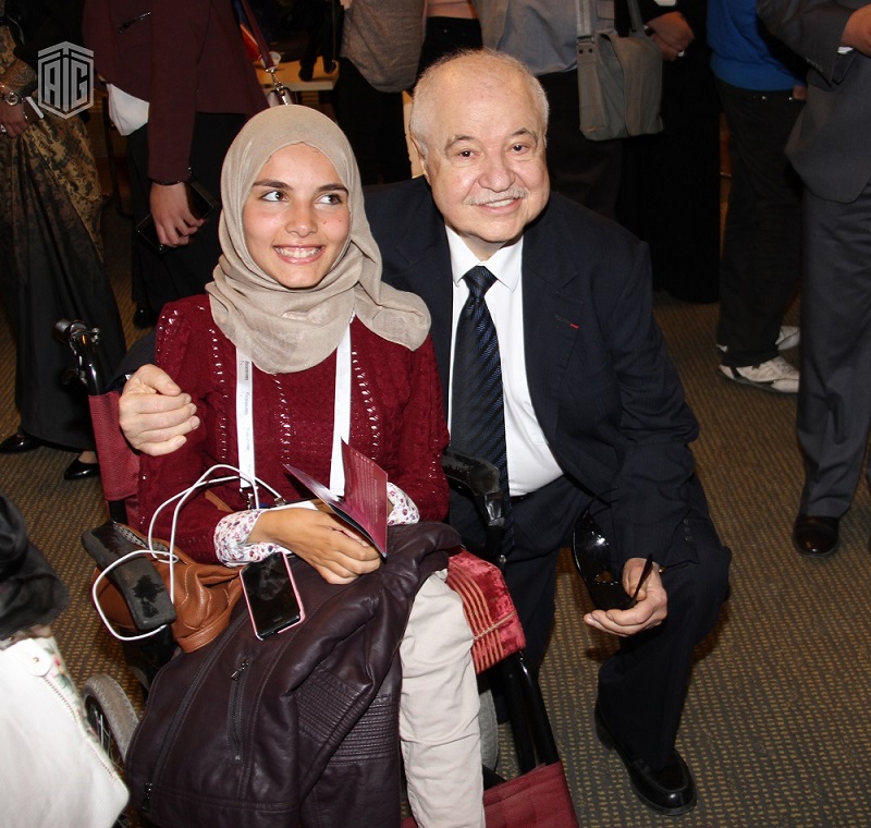 HE Dr. Talal Abu-Ghazaleh with one of the participants in ...