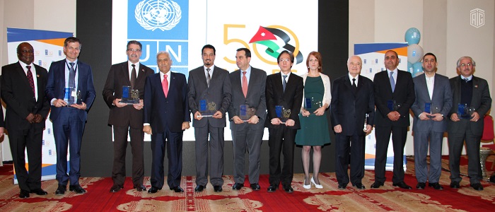 Edward Kallon, resident representative of the United Nations Development Programme (UNDP) honors HE Dr. Talal Abu-Ghazaleh during a special ceremony held under the patronage and presence of the Prime Minister Dr. Abdullah Al-Nsour 