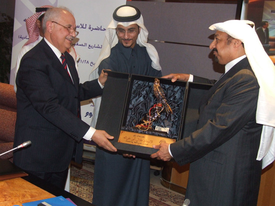 Mr. Hasan Aljasser presents a gift from the 