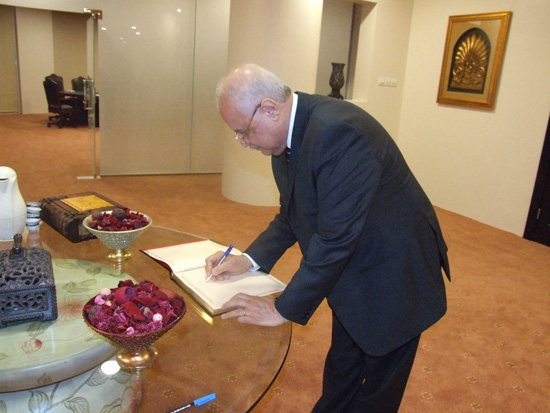 Chairman Talal Abu-Ghazaleh signs his name 
