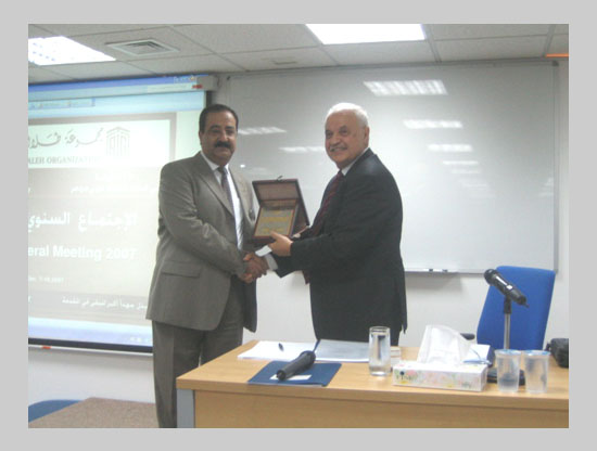 The TAGorg shield is presented to Mr. Munib Hamoudeh, ...