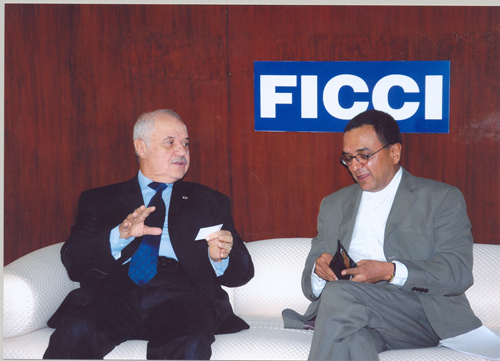 Chairman Talal Abu-Ghazaleh converses with Mr. Yogendra Kr. ...
